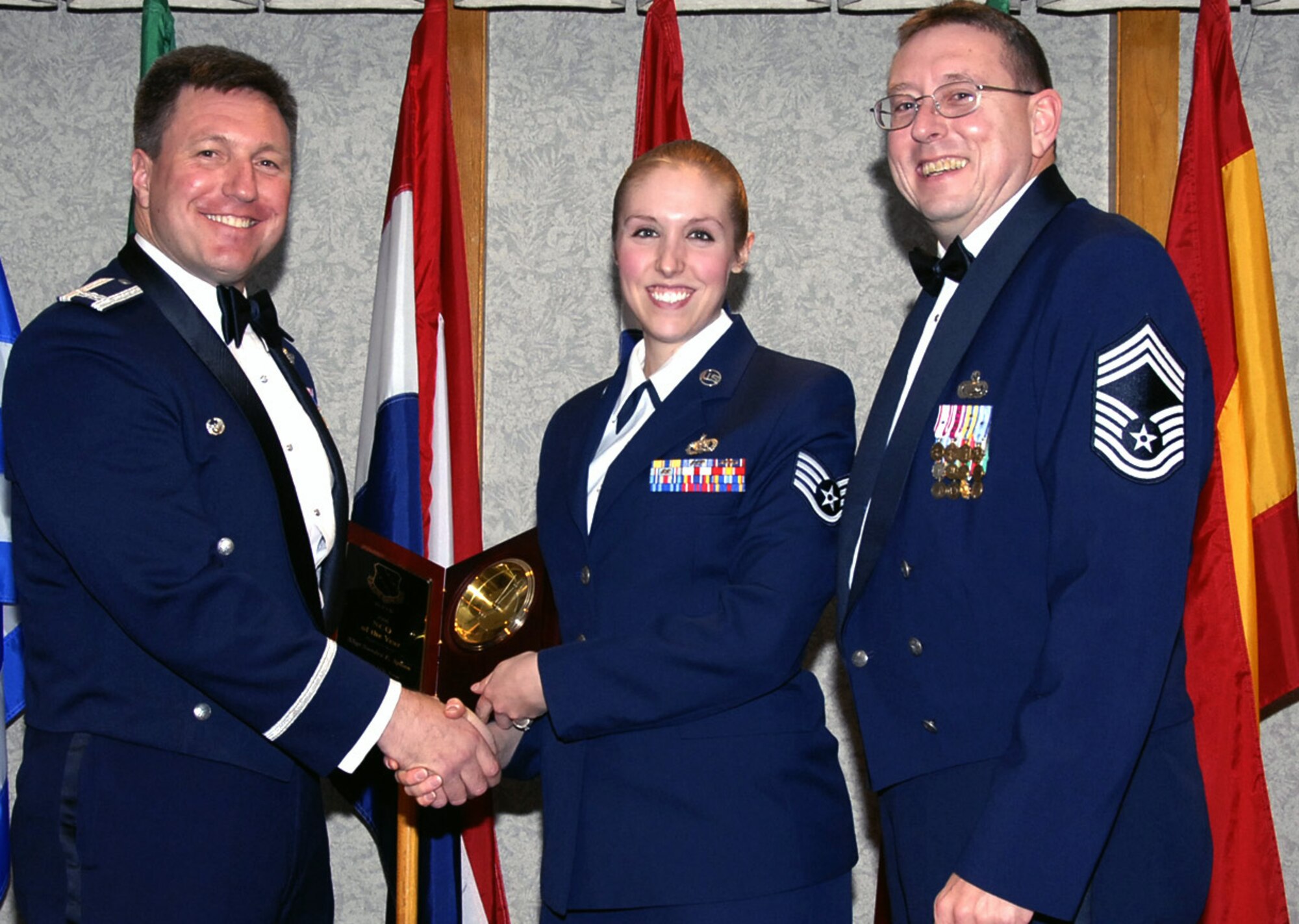 The 80th Operations Group's Staff Sgt. Sandra Spoon is this year's 80th Flying Training Wing Noncommissioned Officer of the Year. Sergeant Spoon was recognized for processing over 800 student action in the integrrated management system during the year. Her accomplishment helped the wing earn an Excellent rating during the recent Operational Readiness Inspection and she was one of four people recognized as an "exceptional performer." Sergeant Spoon is currently working on a bachelor degree and volunteers for programs such as Meals on Wheels and Habitat for Humanity. Also picture, left, 80th FTW Commander Jeffrey Kendall and Chief Master Sgt. Norman Thierolf, 80th FTW superintendent. (U.S. Air Force photo/Harry Tonemah)