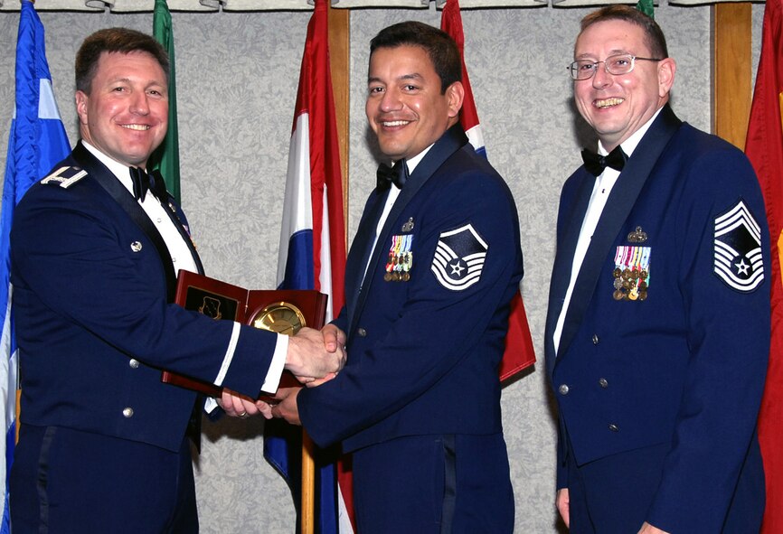 Master Sgt. Gil De La Cerda is the 80th Flying Training Wing's 2006 Senior Noncommissioned Officer of the Year. The 80th Operations Support Squadron sergeant's oversight of the aviation resource management career field and technical expertise led to Excellent ratings for three flying squadron operations sections in the recent Operational Readiness Inspection. He was also hand-picked by the Air Education and Training Command Inspection Team for assistance during the week-long inspection. Sergeant De La Cerda is currently pursing a master's degree in human resource management. He served as president of the 80th FTW's Top 4, was a house captain for Christmas in Action and was key in the delivery of over 25,000 pounds of food to the Wichita Falls Area Food Bank. Also pictured, left, 80th FTW Commander Jeffrey Kendall and Chief Master Sgt. Norman Thierolf, 80th FTW superintendent. (U.S. Air Force photo/Harry Tonemah)