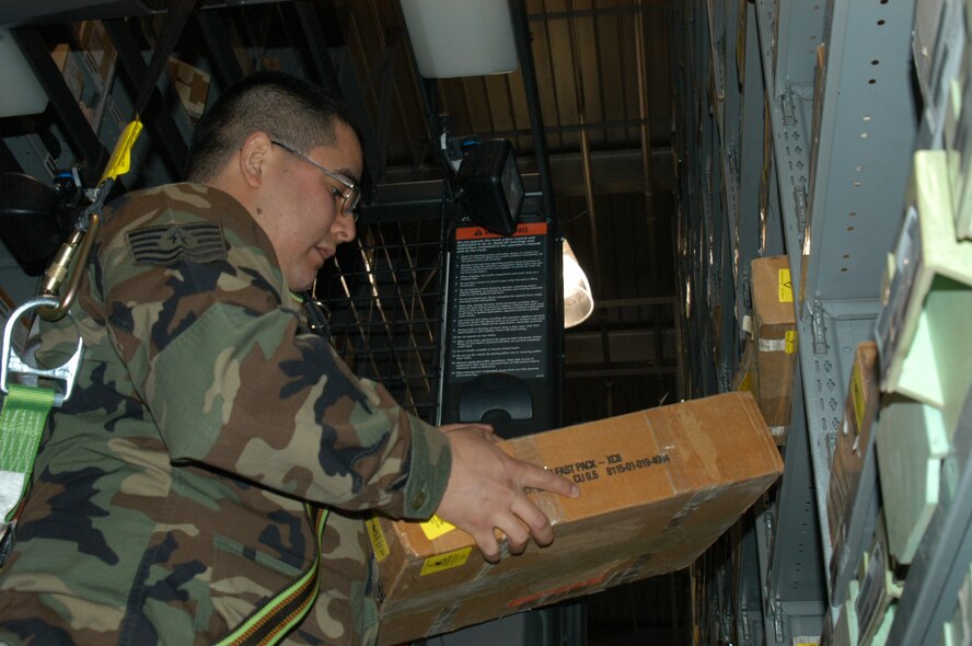 Tech. Sgt. Julian Alvarado, 7th Logistics Readiness Squadron, inspects the supply warehouse Feb. 9. His careful watch over parts that flow in and out caused him to notice a liquid indicator part on a B-1 that could be repaired, saving the Air Force thousands of dollars per year and earning him $10,000. (U.S. Air Force photo by Airman 1st Class Carolyn Viss.)                            