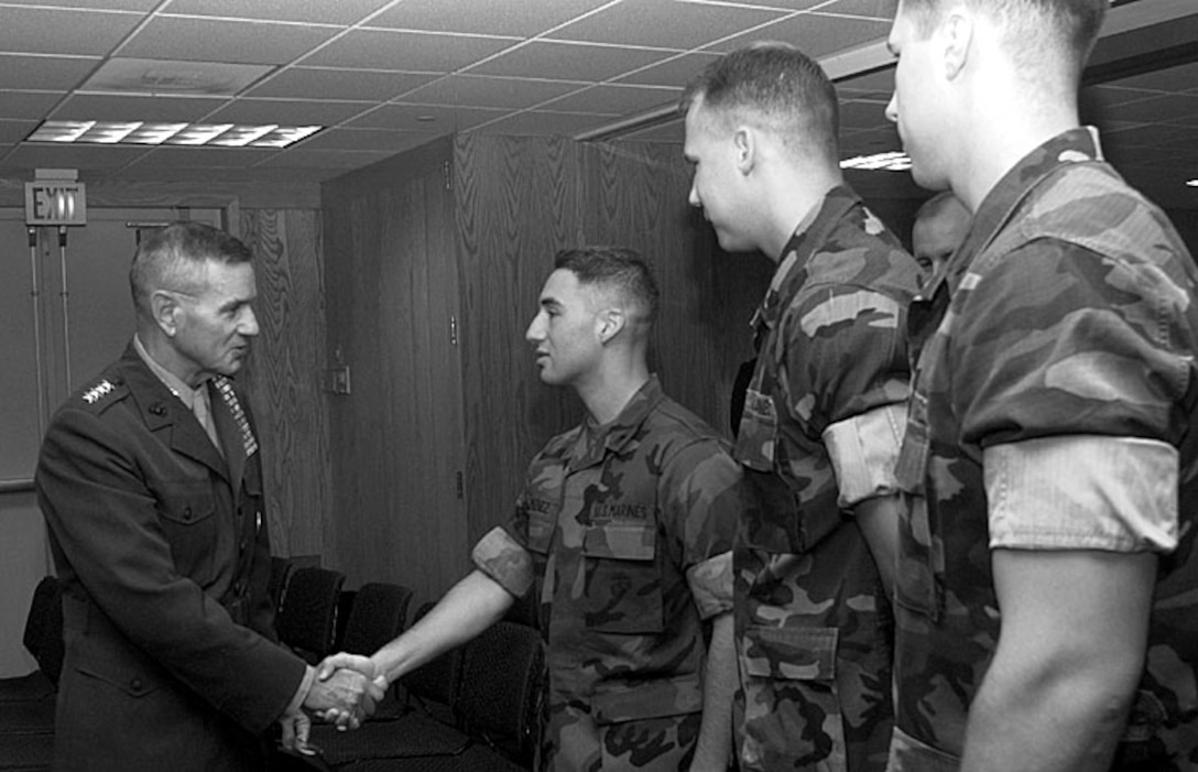 Marine Gen. Charles Wilhelm, commander in chief of 
the U.S. Southern Command, greets members of the Marine Corps 
detachment Dec. 1 at the U.S. Embassy in Lima, Peru. From left 
are Wilhelm; Cpl. Armando Jimenez, Houston; Sgt. Justin Brown, 
Ruston, La.; and Sgt. Gregory Nardi, Long Island, N.Y. Douglas J. 
Gillert