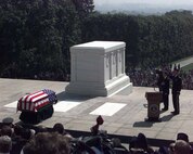 Defense Secretary William S. Cohen and Army Maj. Gen. 
Robert F. Foley, Military District of Washington commander, render 
honors during the National Anthem at the Vietnam Unknown Disinterment 
Ceremony May 14. Staff Sgt. Alicia K. Borlik, USA