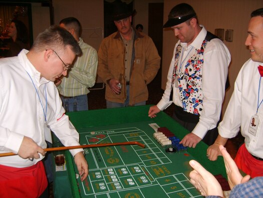 OSAN AIR BASE, Republic of Korea --  Patrons of the Osan Officers’ Spouses’ Club’s Wild West Night enjoy a game of craps Feb. 3. (Photo by Maj. Frank Schreiber)