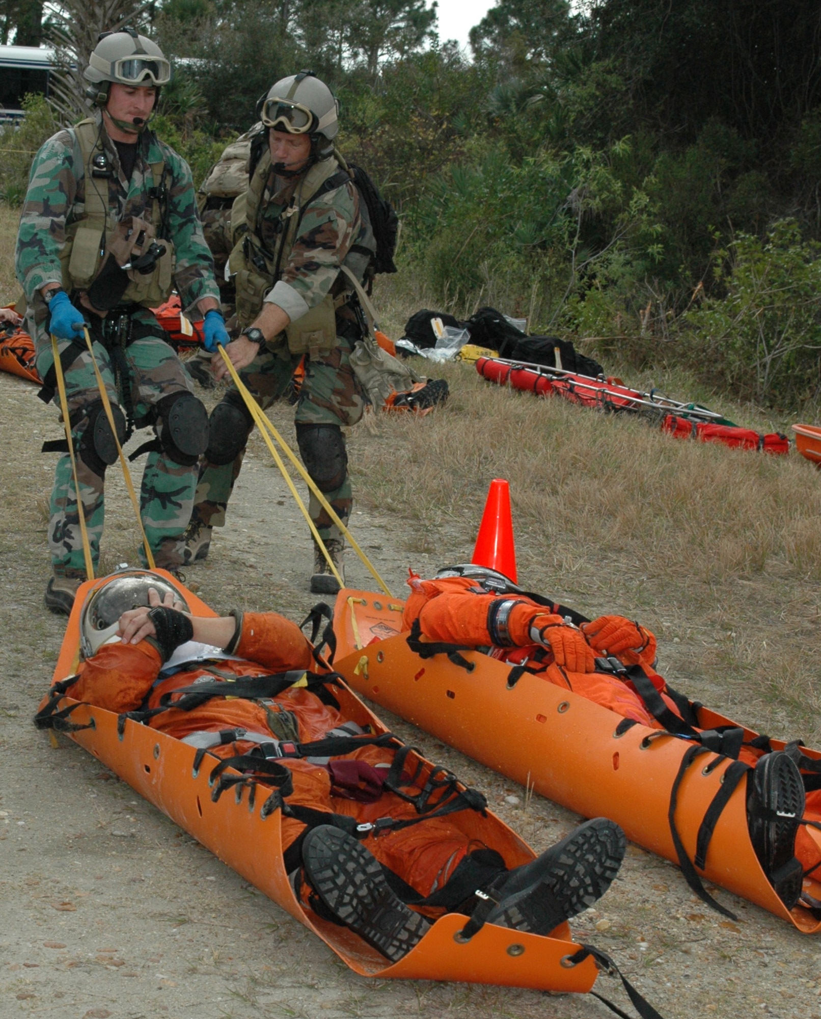 Air Force Reserve pararescuemen from the 920th Rescue Wing out of Patrick Air Force Base, Fla. receive astronauts from NASA emergency firefighters during a Mode 7 Egress Exercise at Cape Canaveral February 13.  The exercise is one of eight possible space shuttle emergency senarios that rescue crews train for.