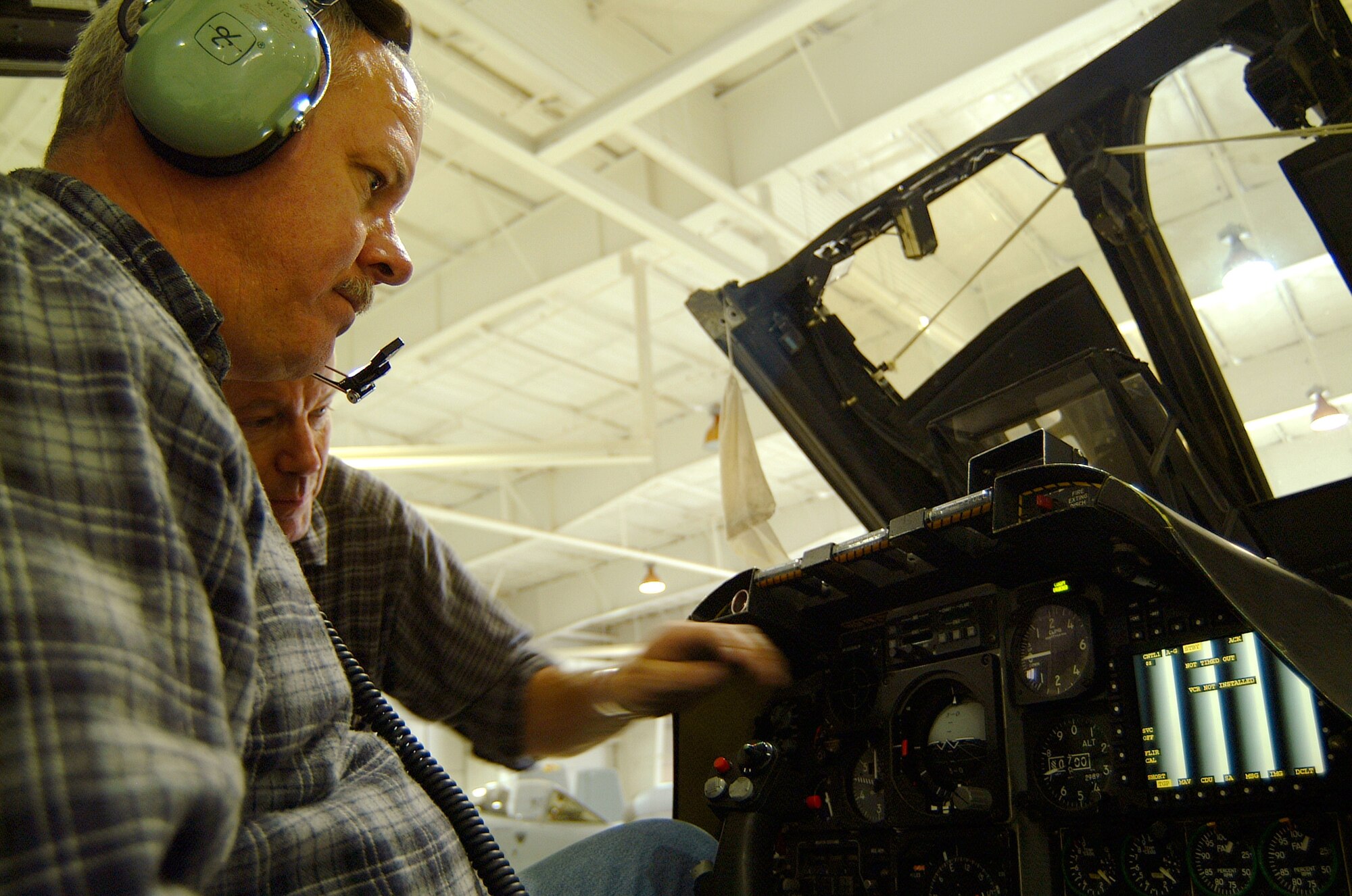 Air Reserve Technician Tech. Sgts. Jim Wilson (left) and Paul Hanson check a test pattern on a newly installed "smart" multi-function color display systems on an A-10 Thunderbolt II from the 442nd Fighter Wing at Whiteman Air Force Base, Mo.  The two sergeants are avionics specialists with the 442nd Aircraft Maintenance Squadron.  (U.S. Air Force photo/Maj. David Kurle) 