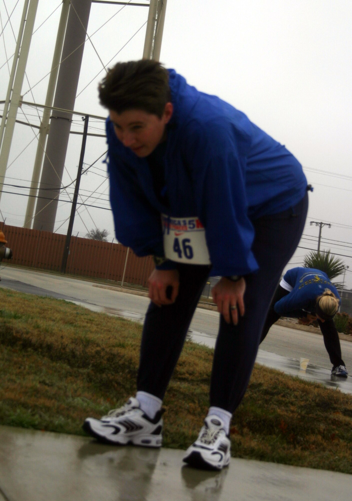 LAUGHLIN AIR FORCE BASE, Texas -- Capt. Lori Katowich, 47th Flying Training Wing, takes a deep breath after completing the Valentine 5K run/walk Feb. 10.  Captain Katowich, 1st place winner of Bracket 3 of the women's category, finished the race in 35 minutes, 42 seconds.  The event was organized by the Losano Fitness Center and was open to everyone.  (U.S. Air Force photo by Senior Airman Olufemi Owolabi)