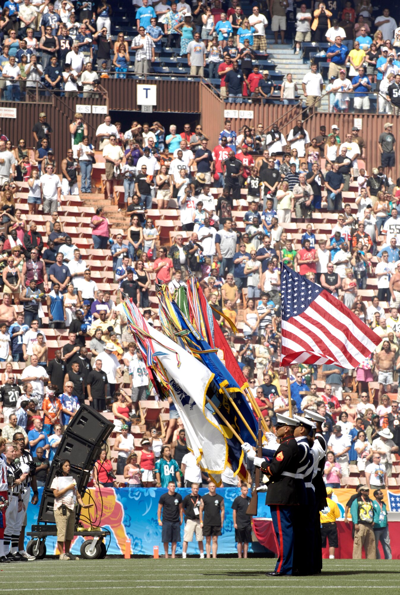 A joint-service honor guard stands at attention during the national anthem at the 2007 Pro Bowl Feb. 10 at Aloha Stadium in Hawaii. Servicemembers from all branches of the U.S. military in Hawaii participated in Pro Bowl activities. The Pro Bowl brings together the top players in the National Football League. (U.S. Air Force photo/Tech. Sgt. Shane A. Cuomo) 
