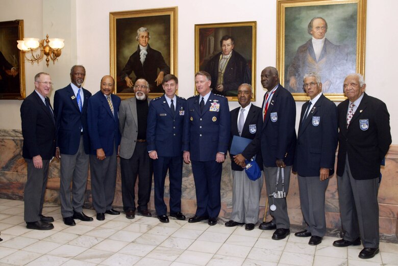 Maj. Gen. Scott A. Hammond (fifth from left) and Lt. Gen. John A. Bradley (sixth from left) are joined by members and World War II veterans of the Atlanta Chapter Tuskegee Airmen to kickoff the "Heritage to Horizons" theme celebration of the Air Force 60th Anniversary at the Georgia Capitol Feb. 12 in Atlanta. General Hammond is the Georgia Air National Guard commander, and General Bradley is the chief of the Air Force Reserve. (U.S. Air Force photo/Don Peek) 
