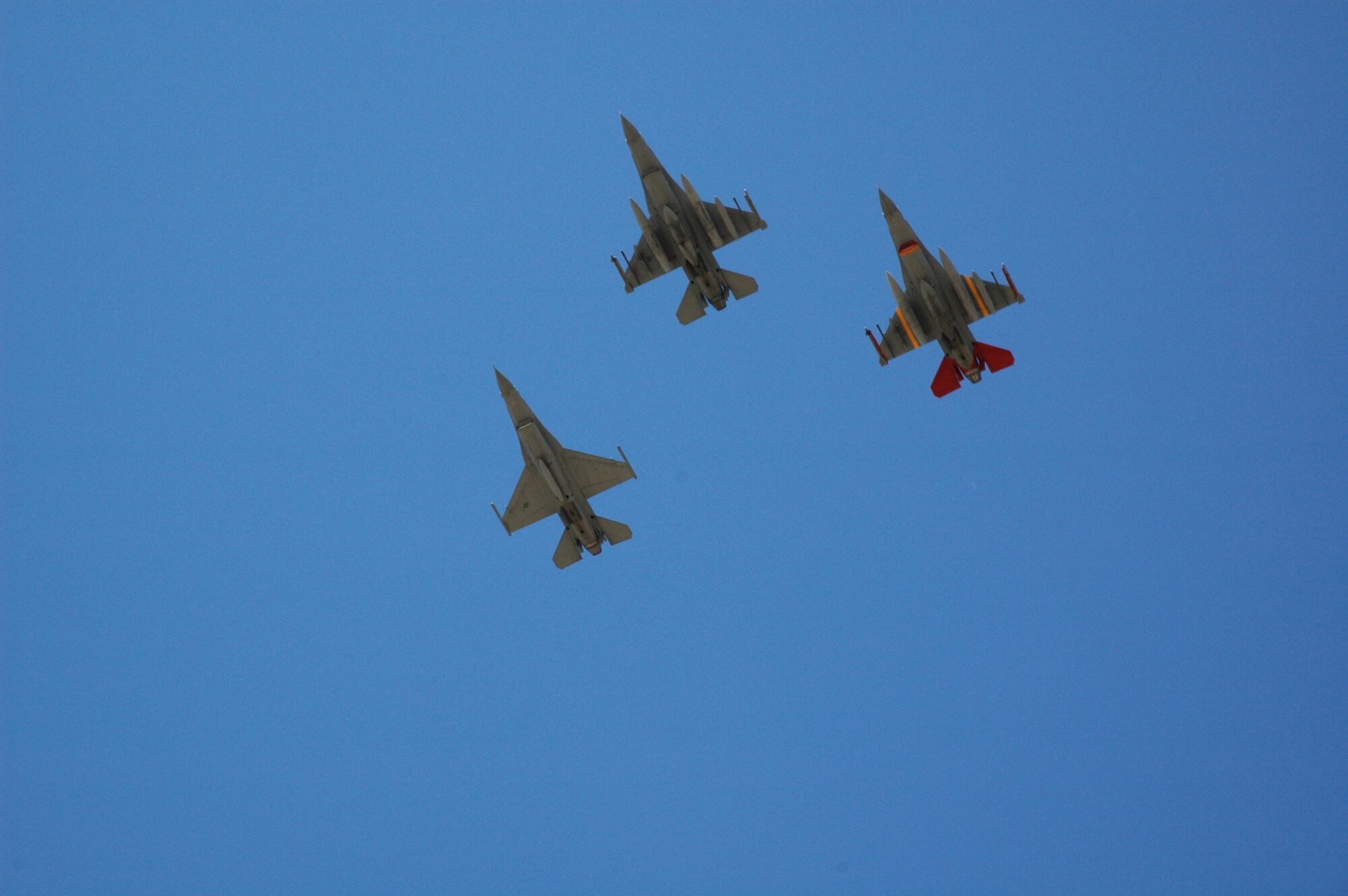 The last three F-16 Fighting Falcons assigned to the 944th Fighter Wing perform a ceremonial flyover over Luke Air Force Base, Ariz., Feb. 12 as hundreds of unit members bid farewell. The three F-16s were the last of 17 to depart the base as part of Base Realignment and Closure Commission actions. (U.S. Air Force photo/Staff Sgt. Susan Stout)