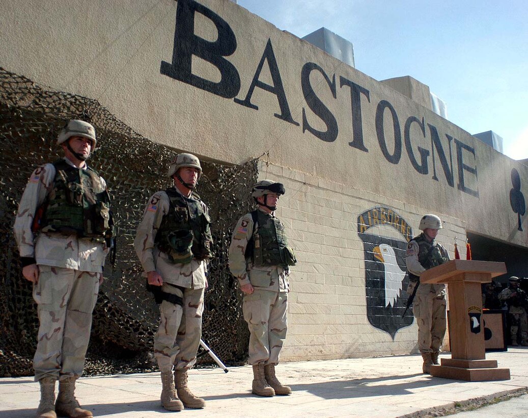 From left to right, Col. Ben Hodges, commander, 1st Brigade,  327th Infantry Regiment, 101st Airborne Division (Air Assault); Maj. Gen. David  Petraeus, division commander; and Lt. Col. Karl Reed, commander, 5th Battalion,  20th Infantry Regiment, 3rd Brigade (Stryker) 2nd Infantry Division, stand at  attention during a transfer-of-authority ceremony in northern Iraq today. The  soldiers from Task Force 5/20 are taking over for the 101st soldiers, who had  been in Iraq for 11 months and had worked in the Tigris River Valley since May.  Photo by Spc. Joshua Hutcheson, USA