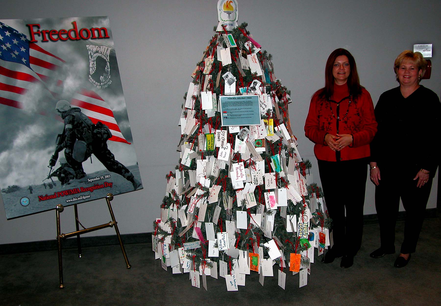 peggy-marish-boos-left-and-debbie-landon-pose-by-the-pow-mia-holiday