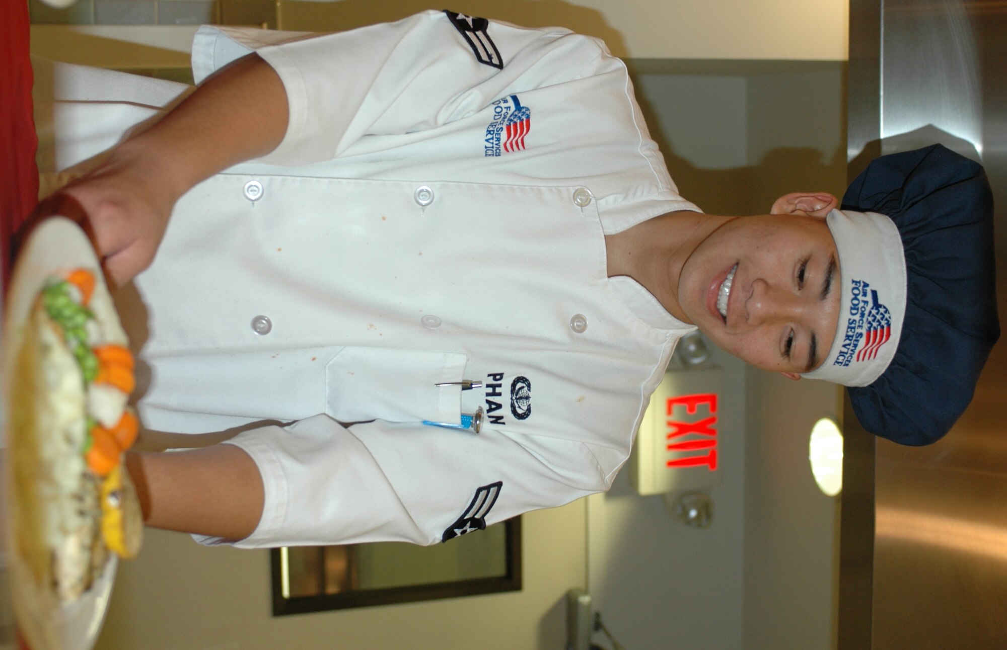 Airman 1st Class Khoa Phan, 60th Services Squadron chef, prepares for the dinner meal. The 60th Services Squadron’s Food Service Flight is preparing for the 2007 Air Force Hennessy Award competition. The award is presented to the Air Force base with the best food service program, evaluates all aspects of a facility’s program including kitchen operations, serving and dining operations, training and readiness, sanitation and repair, and management. (U.S. Air Force photo by Staff Sgt. Candy Knight)