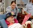 Senior Airman Leslie Fuller, 437th Medical Group Bio-environmental Flight, gives Valentine's Day cards made by local school children to William Grady, a Navy veteran who served from 1941 to 1949. (U.S. Air Force photo/Airman 1st Class Nicholas Pilch)