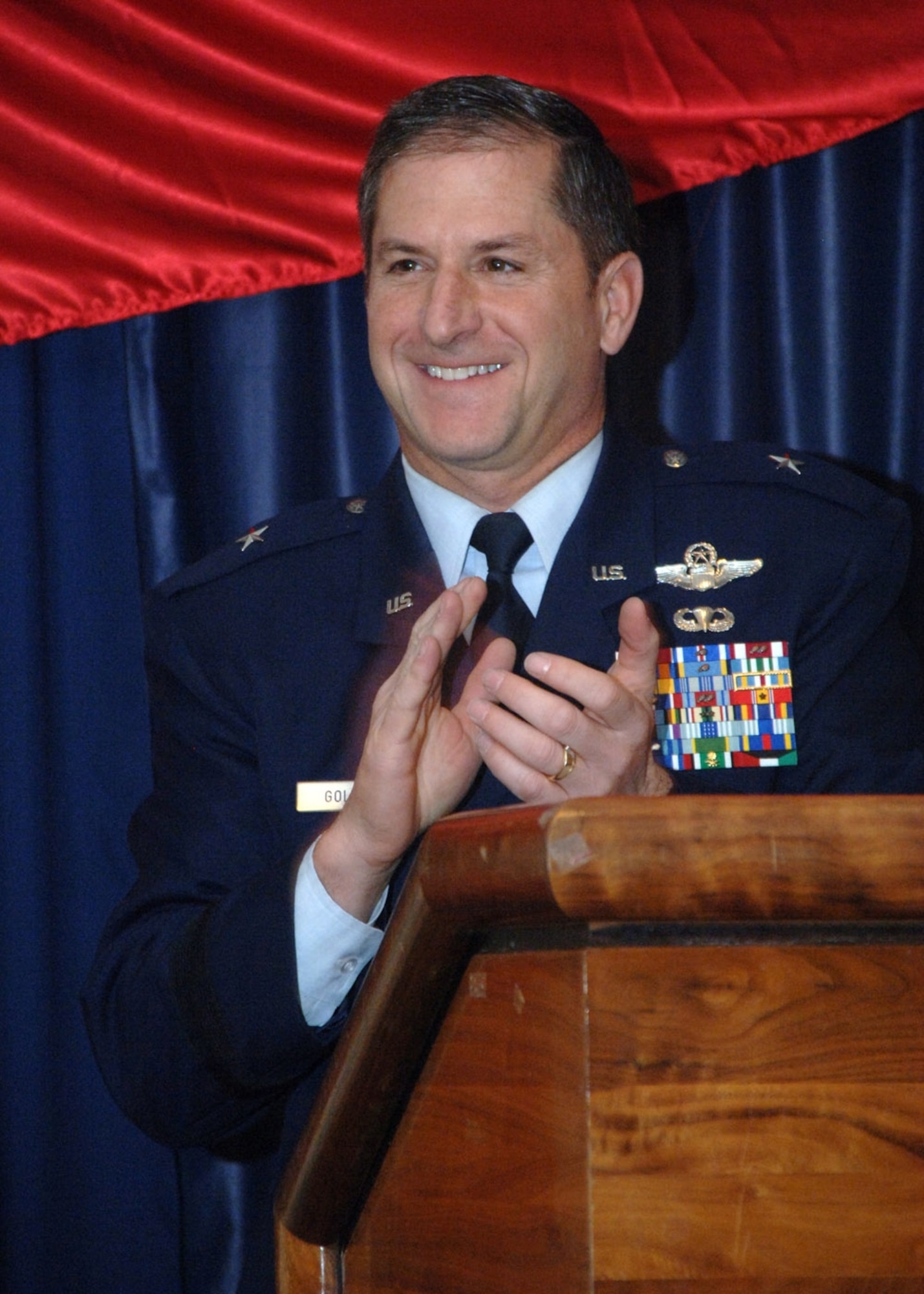 Brig. Gen. David Goldfein, 49th Fighter Wing commander, thanks chap (Brig. Gen.) Cecil Richardson, U.S. deputy chief of chaplains, for speaking at the breakfast after presenting him with a wing coin.