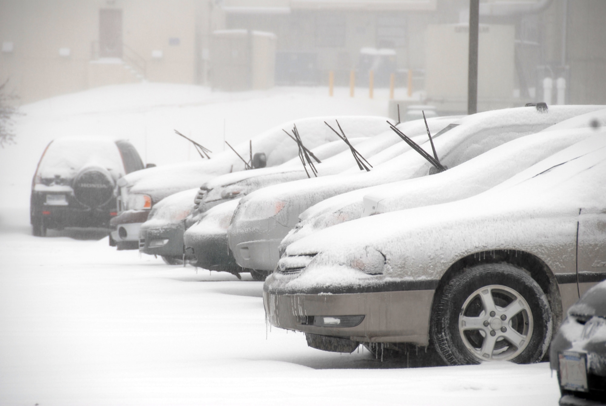 Many base commuters raised their windshield wipers to prevent the blades from freezing to the windshield due to the cold temperatures. Hanscom received approximately five inches of snow and a mix of freezing rain. (US Air Force Photo by 1st Lt. Geoff Buteau)