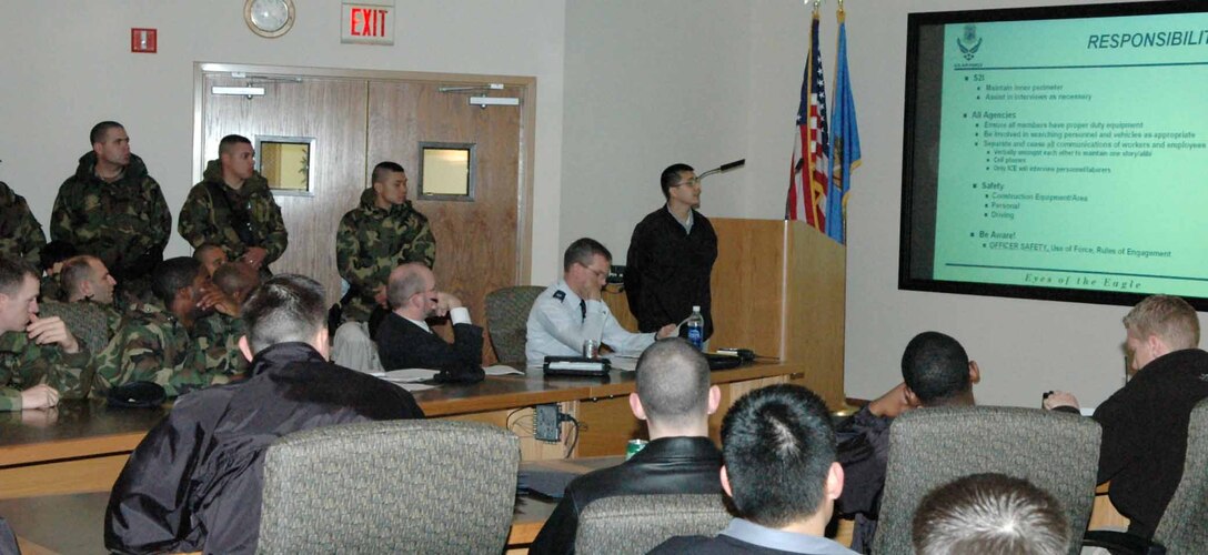 Special Agent Phillip Armenta, Detachment 114, Air Office of Special Investigations, runs through the rules of engagement for the Jan. 12 joint worksite enforcement operation with security and law enforcement officials set to participate in Operation Public Law. (U.S. Air Force photo by Ralph Monson)