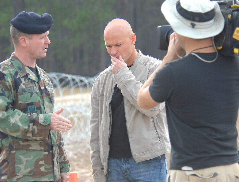 MOODY AIR FORCE BASE, Ga. -- Col. John Decknick, 820th Security Forces Group commander, conducts an interview with Richard "Mack" Machowicz, host of the Discovery Channel’s “Future Weapons.” While at Moody, the show covered the Active Denial System, the nonlethal, direct energy weapon currently being evaluated by the 820th SFG. The show is scheduled to air in April. (U.S. Air Force photo by Airman 1st Class Gina Chiaverotti)
