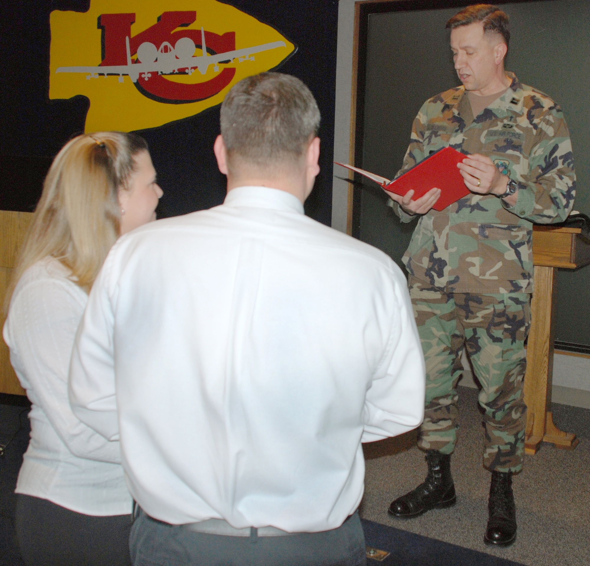 Wing chaplain, Capt. Jim Buckman, right, performs a marriage ceremony for Staff Sgt. Sandra Rougeau and Senior Master Sgt. Morris Findley Jan. 6 in the 442nd Fighter Wing conference room.  Both sergeants are reservists in the 442nd FW.  (U.S. Air Force photo/Staff Sgt. Tommy Talbert)