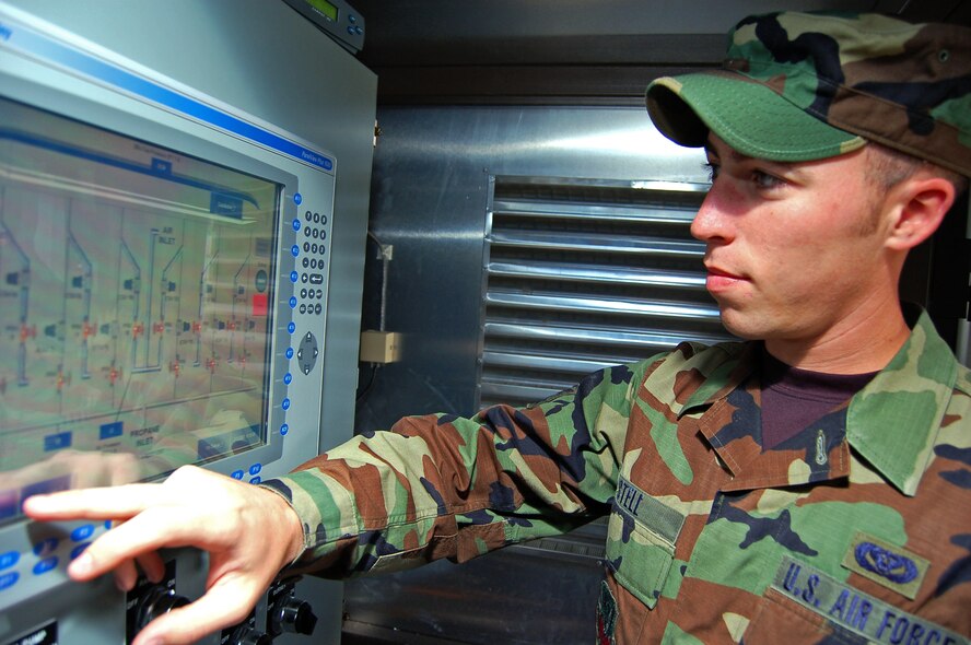 Senior Airman William Stell, 23rd Civil Engineer Squadron liquid fuels journeyman, adjusts the water tank temperature in the heat exchanger of Moody's new propane air-mix plant. The $865,000 plant converts liquid propane into a substitute for natural gas during high-price billing periods.  (U.S. Air Force photo by Tech. Sgt. Parker Gyokeres)
