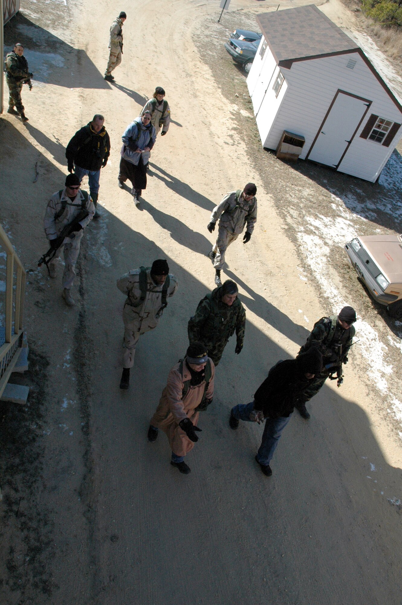 "Deployed American forces" walk to the village of  "Citheron" during a scenario Feb. 9 for exercise Eagle Flag at the Naval Air Engineering Station in Lakehurst, N.J. The exercise is coordinated and controlled by the Air Mobility Warfare Center's 421st Combat Training Squadron from Fort Dix, N.J.  (U.S. Air Force photo/Tech. Sgt. Scott T. Sturkol)