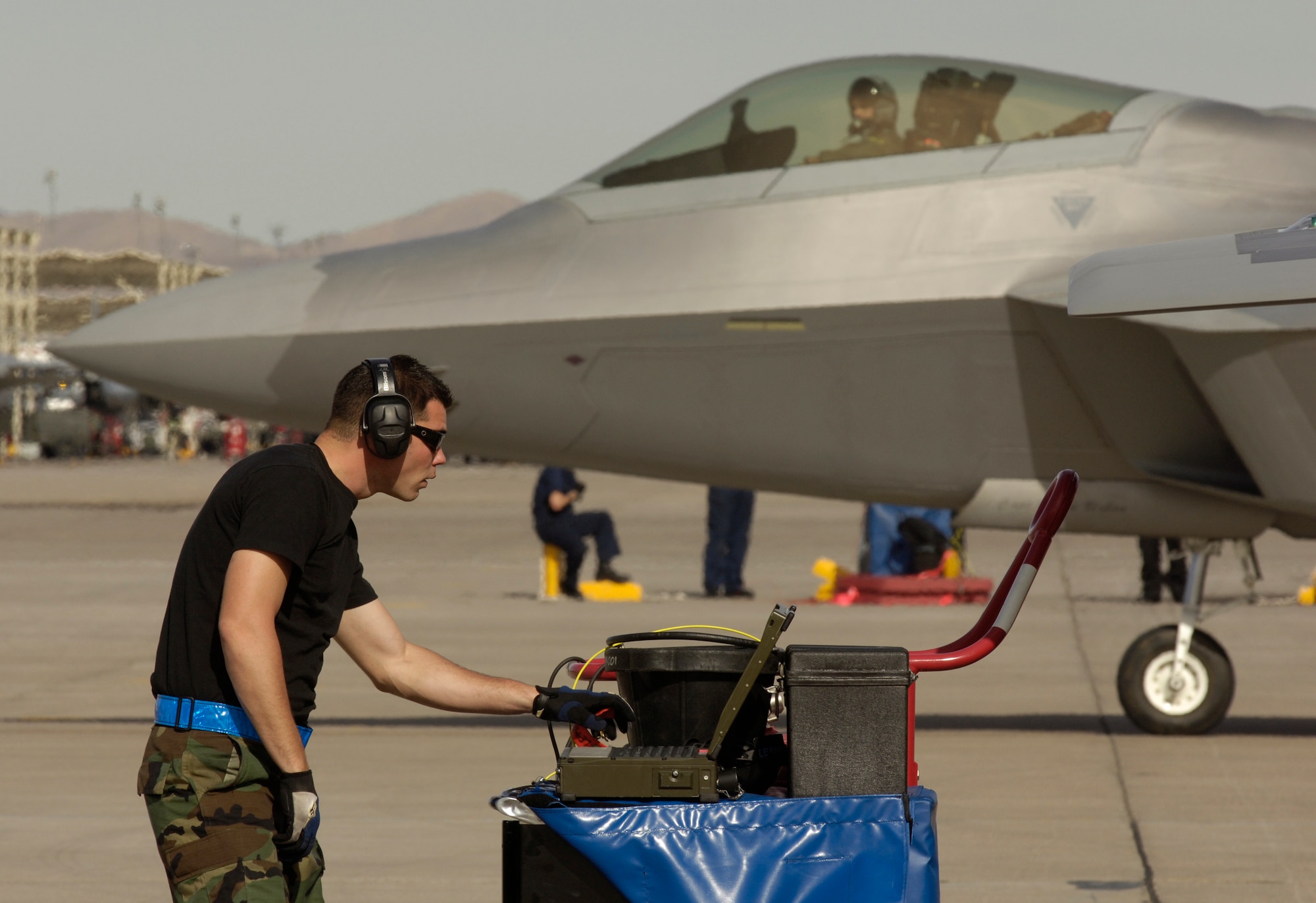 Senior Airman William Rotroff reviews F-22 Raptor data on a portable maintenance aid during Red Flag Feb. 6 at Nellis Air Force Base, Nev. The exercise sharpens aircrews' warfighting skills in realistic combat situations. This is the first deployment to Red Flag for the 94th Fighter Squadron with F-22 Raptors. Airman Rotroff is a tactical aircraft maintenance specialist at the 94th FS from Langley AFB, Va. (U.S. Air Force photo/Master Sgt. Kevin J. Gruenwald) 