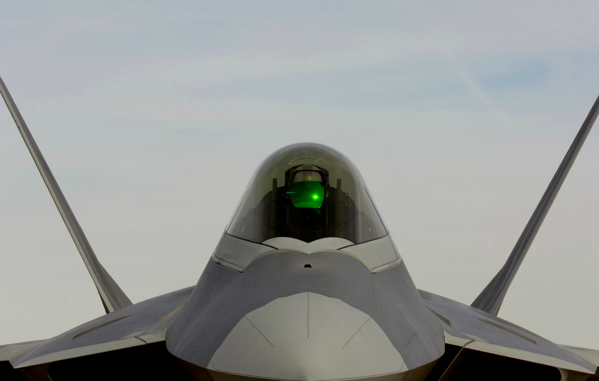 An F-22 Raptor from 94th Fighter Squadron at Langley Air Force Base, Va., sits on the flightline during Red Flag Feb. 6 at Nellis AFB, Nev. The exercise sharpens aircrews' warfighting skills in realistic combat situations. The aircraft are flying missions day and night at the nearby Nevada Test and Training Range where they simulate an air war. The Air Force and Navy, along with Australia and the United Kingdom militaries, are participating in the exercise. This is the first deployment to Red Flag for the 94th FS with F-22s. (U.S. Air Force photo/Master Sgt. Kevin J. Gruenwald) 
