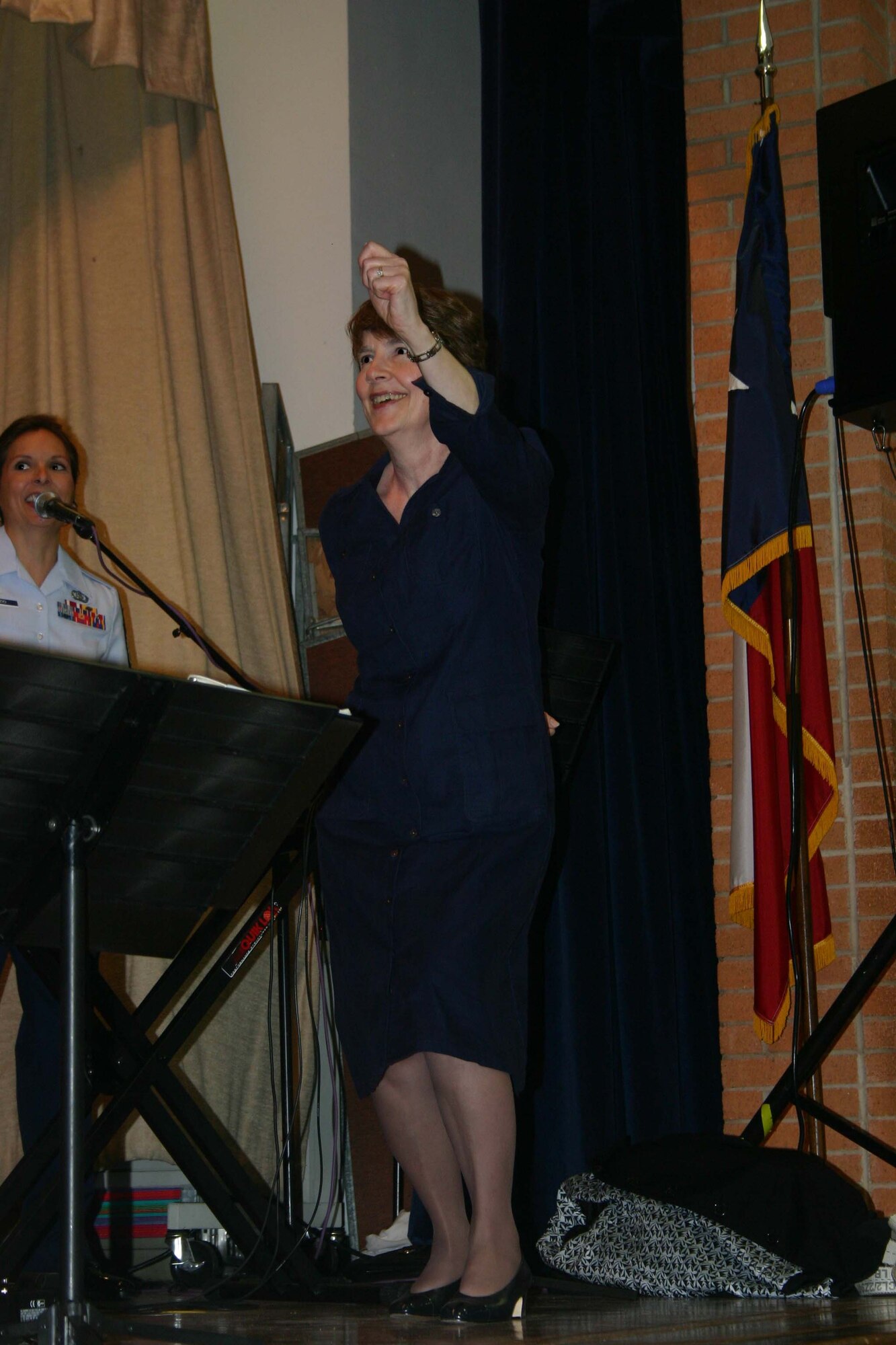 Judy Whalen, a teacher at Sheppard Elementary, participates in an impromptu dance contest during the Top Flight concert Feb. 12. (U.S. Air Force Photo/Staff Sgt. Tonnette Thompson)