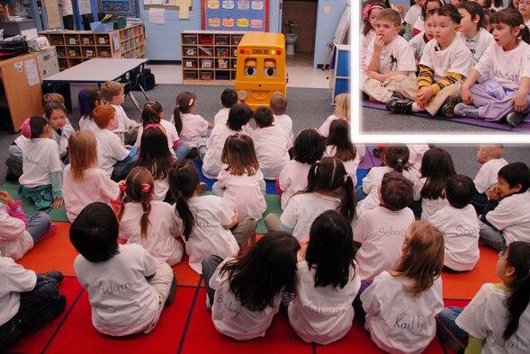 OSAN AIR BASE, Republic of Korea --  Dylan Shipley, Justin Stewart, and Megan Pina (inset) listen as Barney the School bus teaches about school bus safety Feb. 13 at Osan American Elementary School. The children are in Mrs. Deb Alcott's kindergarten class. (U.S. Air Force photo by Airman 1st Class Chad Strohmeyer)