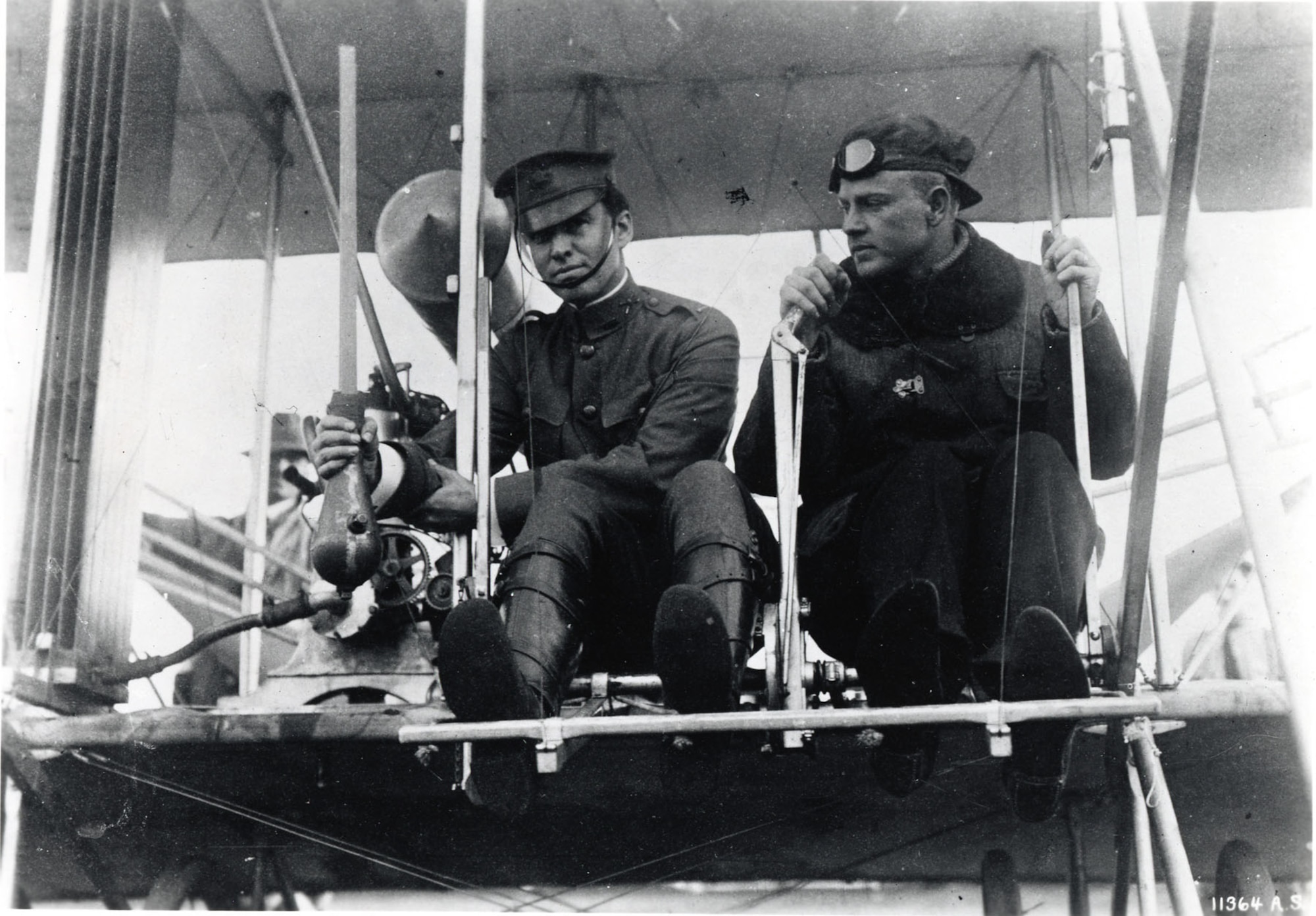 Phil Parmalee and Lt. Myron Crissy (left) with first live bomb in a Wright plane, Los Angeles, Jan. 15, 1911. (U.S. Air Force photo)
