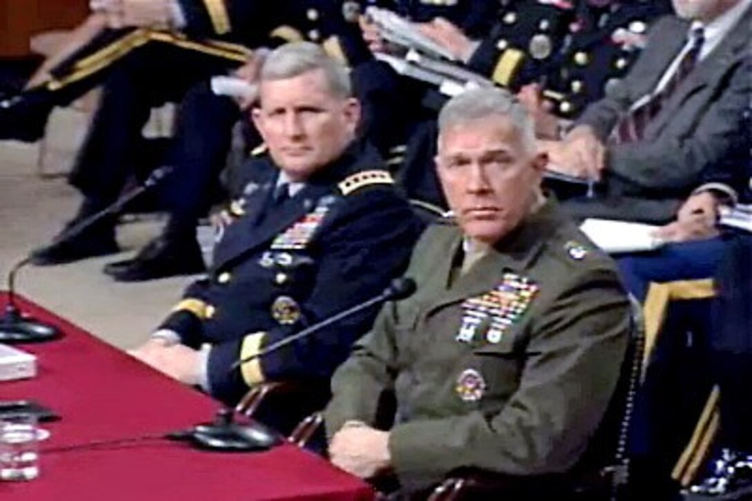 U.S. Army Gen. Peter Schoomaker, Army chief of staff (left), and Marine Gen. James Conway, commandant of the Marine Corps (right), testify before the Senate Armed Services Committee on current and future Army and Marine Corps readiness, Feb. 15, 2007.