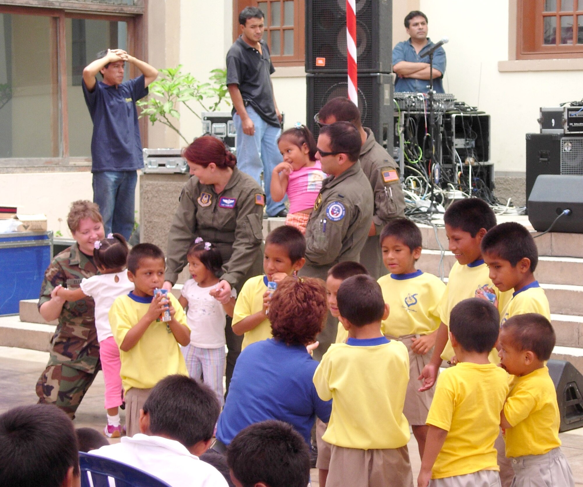Aircrew members visit with children at a local foster home Feb. 16 at Lima, Peru. Airmen in Peru wrapped up the joint exercise Falcon and Condor 2007 this week and are remaining there for the first joint air show with the Peruvian Air Force this weekend. The Peruvian air show will be the first of the year for aircraft from the 12th Air Force and Air Forces Southern. The joint exercise and air show directly supports U.S. Southern Command's engagement goals and furthers relations between allied nations. (Courtesy photo)