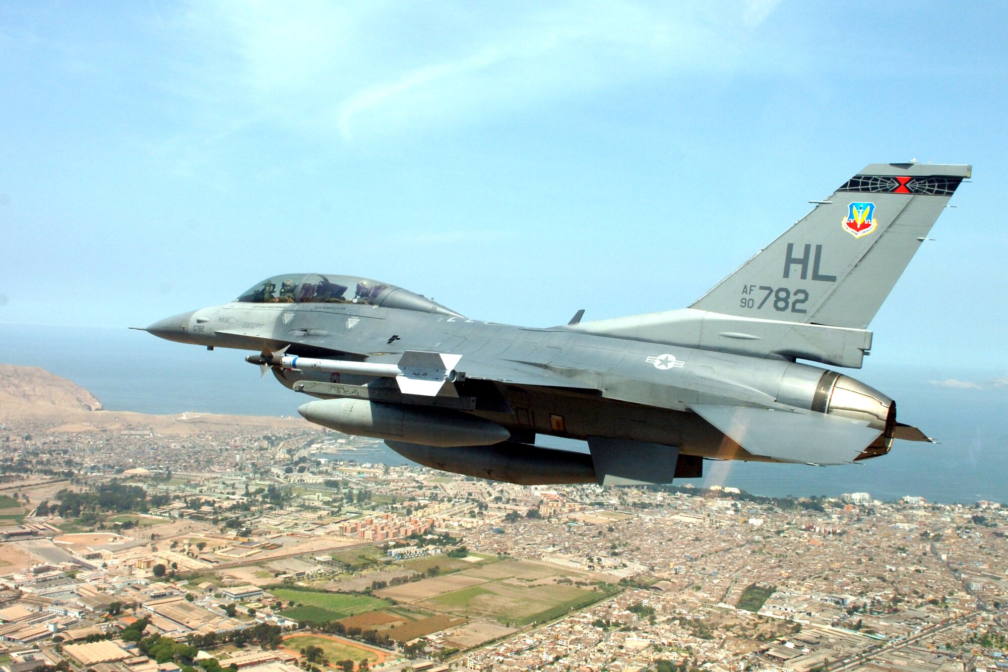 An F-16 Fighting Falcon Utah flies over Lima, Peru, on its way to the city for a joint air show with the Peruvian Air Force. The Peruvian air show will be the first of the year for aircraft from the 12th Air Force and Air Forces Southern. The F-16 is from the 34th Fighter Squadron at Hill Air Force Base, Utah. (U.S. Air Force photo/Tech. Sgt. Eric Kreps)