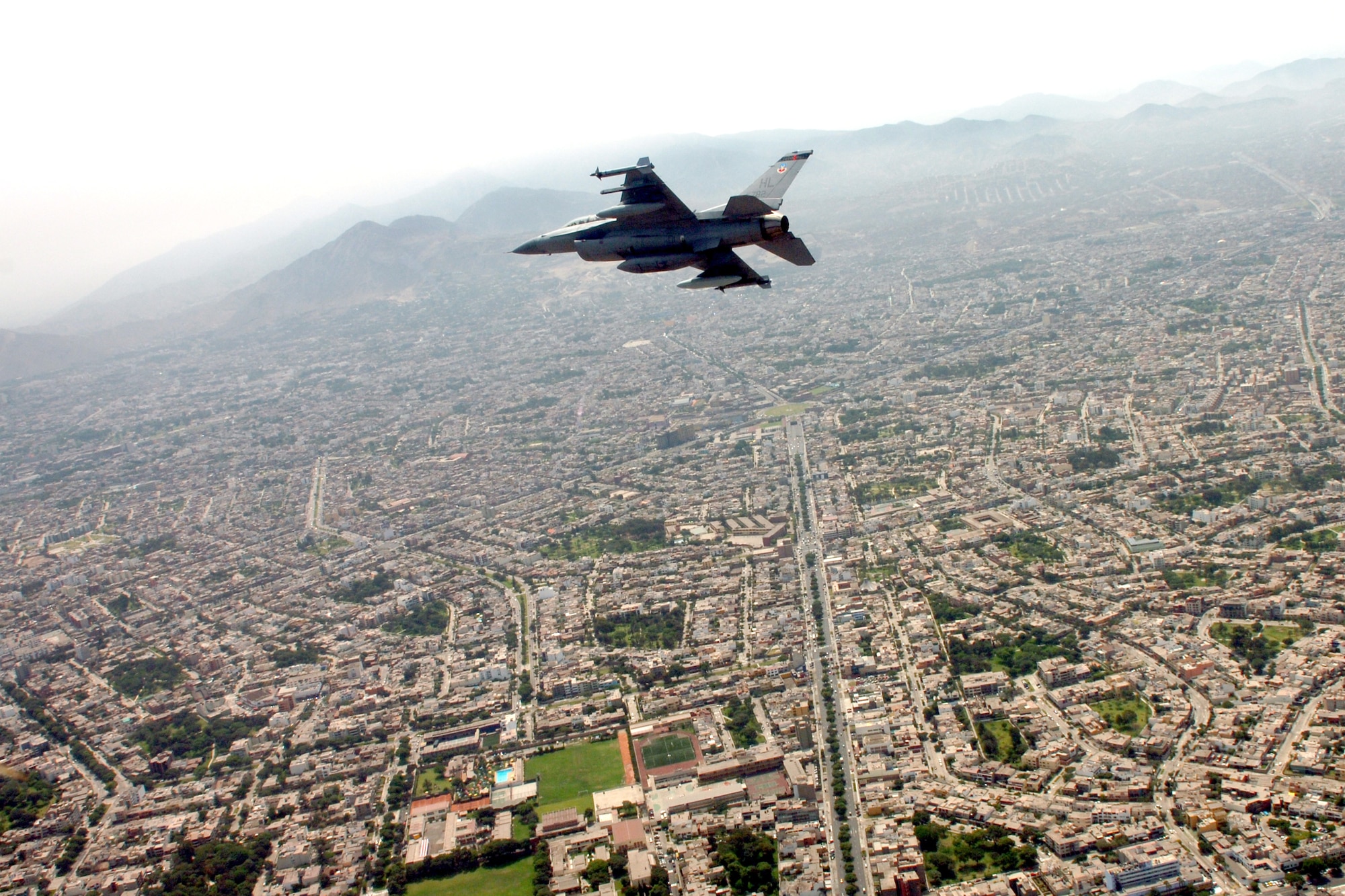 An F-16 Fighting Falcon Utah flies over Lima, Peru, on its way to the city for a joint air show with the Peruvian Air Force. The Peruvian air show will be the first of the year for aircraft from the 12th Air Force and Air Forces Southern. The F-16 is from the 34th Fighter Squadron at Hill Air Force Base, Utah. (U.S. Air Force photo/Tech. Sgt. Eric Kreps)