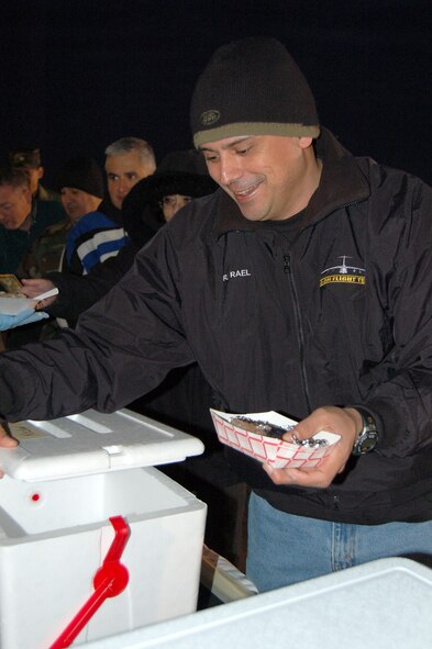 The annual Cowboy Breakfast, an event scheduled to coincide with the San Antonio Stock Show and Rodeo Breakfast downtown, offered members of the ALamo Wing free breakfast tacos, biscuits and sausage gravy and hot coffee. The hot meal was welcome in the early morning hours where the temperatures dipped well below the normal for South Texas. Local merchants, including the Lackland Commissary, contributed the ingredients for the morning menu. (U.S. Air Force Photo/Master Sgt. Collen McGee)