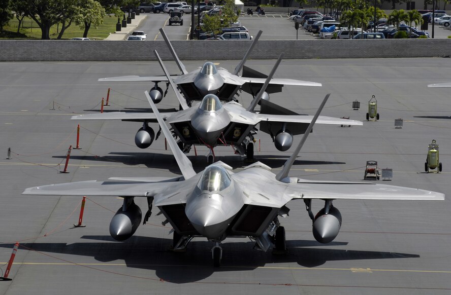 HICKAM AIR FORCE BASE, Hawaii -- F-22 Raptors sit on the flight line at Hickam Air Force Base, Hawaii Feb. 12, 2007. The F-22’s and more than 250 Airmen from the 27th Fighter Squadron at Langley Air Force Base, Va., are bound for Kadena Air Base, Japan, for the aircraft’s first overseas operational deployment. (U.S. Air Force photo/ Tech. Sgt. Shane A. Cuomo)