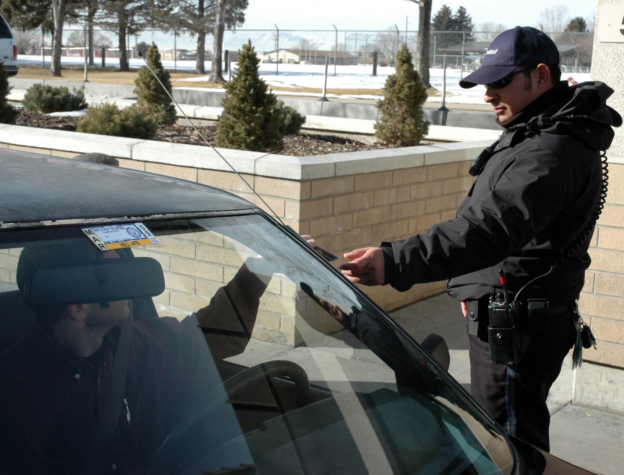 Constant identification checks at Hill Air Force Base, Utah, led base officials to eliminate auto decals. The Air Force decided to adopt this money-saving decision and will stop requiring bases to issue decals effective March 15. (Photo by Beth Young)