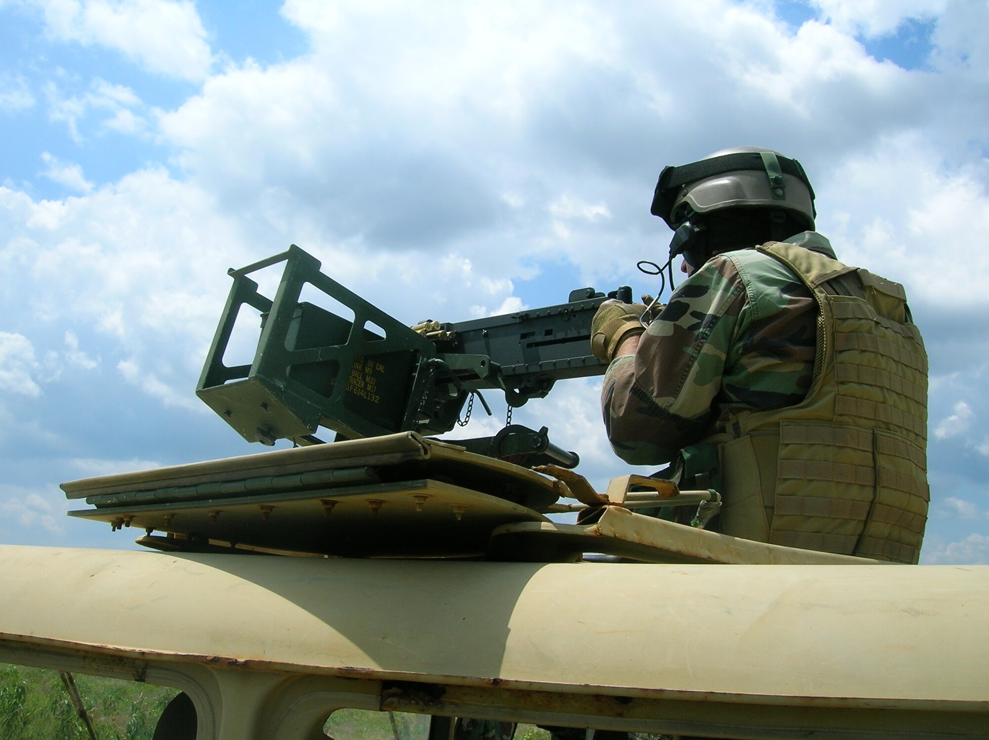 An Army Special Forces Soldier does live-fire maneuver training on Eglin test ground Bravo-75 with a 50-caliber machine gun. (Photo by Chief Warrant Officer Todd Sowerby.)