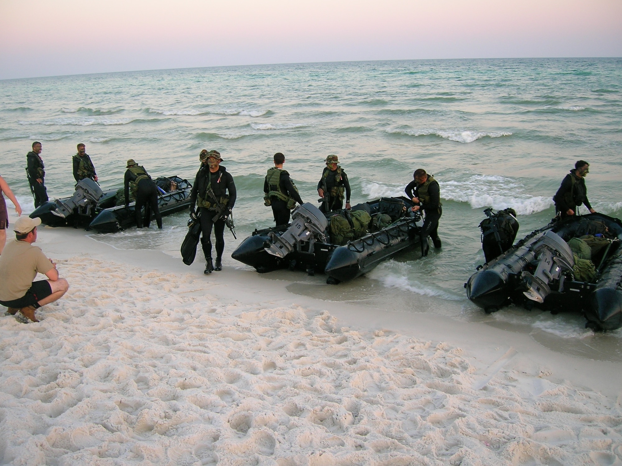 JGLOs practice training maneuvers on the beach. (Photo by Chief Warrant Officer Todd Sowerby.)