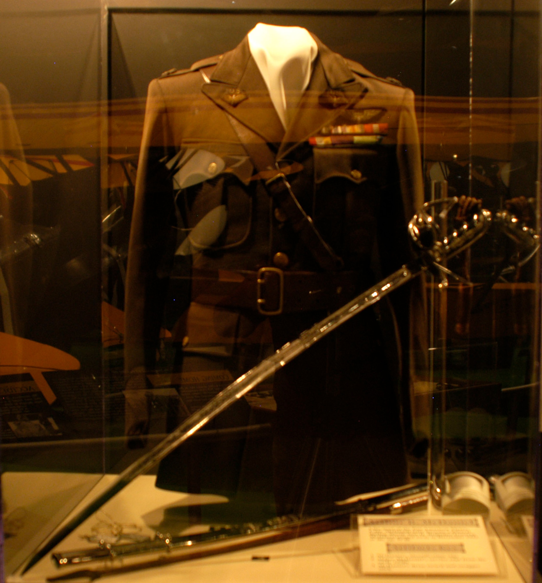 DAYTON, Ohio -- Capt. Arthur B. McDaniel's identification tags, service coat from the early 1930s when he was a major, dress sword and swagger stick on display in the Early Years Gallery at the National Museum of the U.S. Air Force. Like most of the Pan American Flyers, McDaniel later became a general during World War II. He passed away in December 1943 at the age of 43. (U.S. Air Force photo)