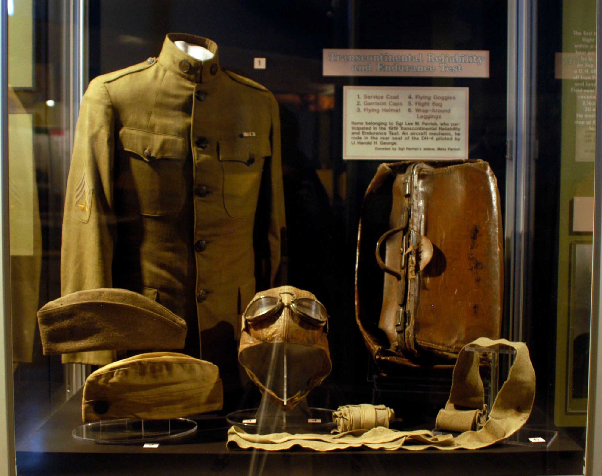 DAYTON, Ohio -- Items from Sgt. Lee M. Parrish who participated in the 1919 Transcontinental Reliability and Endurance Test are on display in the Early Years Gallery at the National Museum of the United States Air Force. Parrish flew in the rear seat of the DH-4 piloted by Lt. Harold H. George and served as the airplane's mechanic. The items were donated by Sgt. Parrish's widow, Mrs. Neta Parrish. (U.S. Air Force photo)