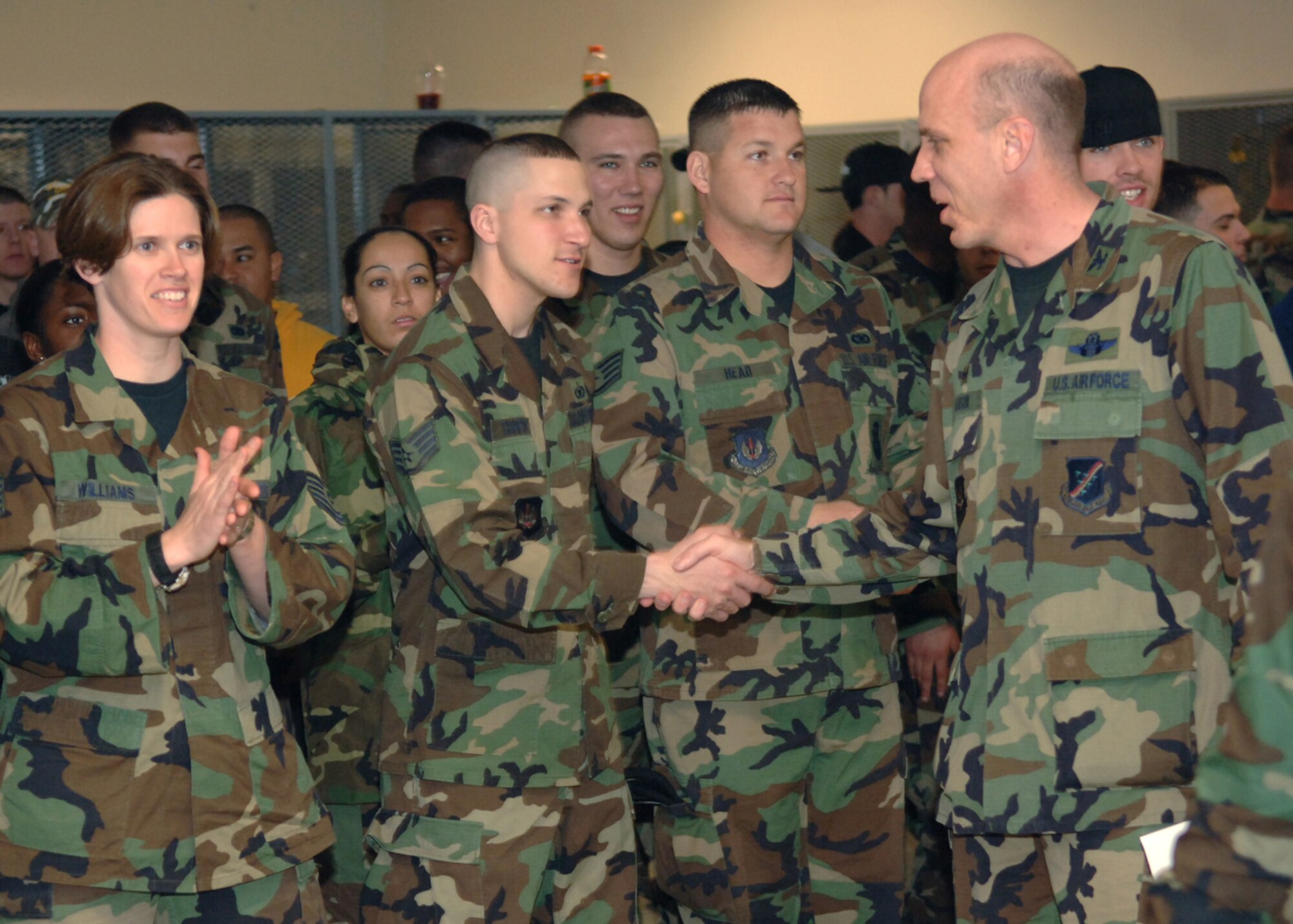 Col. Jeffrey Hanson, 39th Mission Support Group commander, shakes hands with the Airmen of the 39th SFS for their hard work Feb. 15. Members of the 39th SFS gathered in the Armory to receive recognition for being USAFE Best Large Security Forces Squadron for 2006.  (U. S. Air Force photo by Airman First Class Nathan W. Lipscomb)