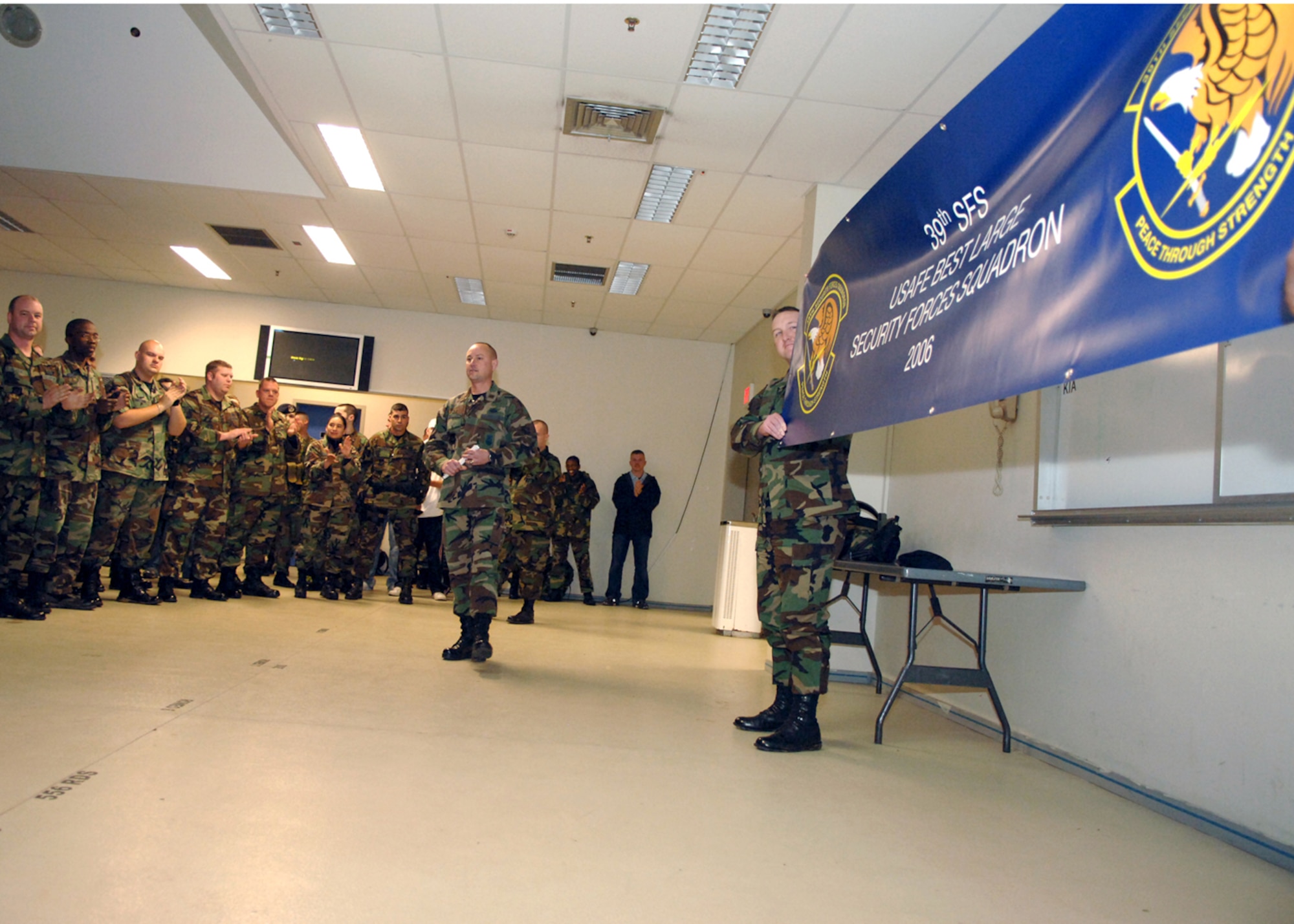 Maj. Bryan Gillespie, 39th Security Forces Squadron commander, congratulates the Airmen of the 39th SFS for winning the U. S. Air Forces in Europe Best Large Security Forces Squadron for 2006 Feb. 15.  (U. S. Air Force photo by Airman First Class Nathan W. Lipscomb)      
