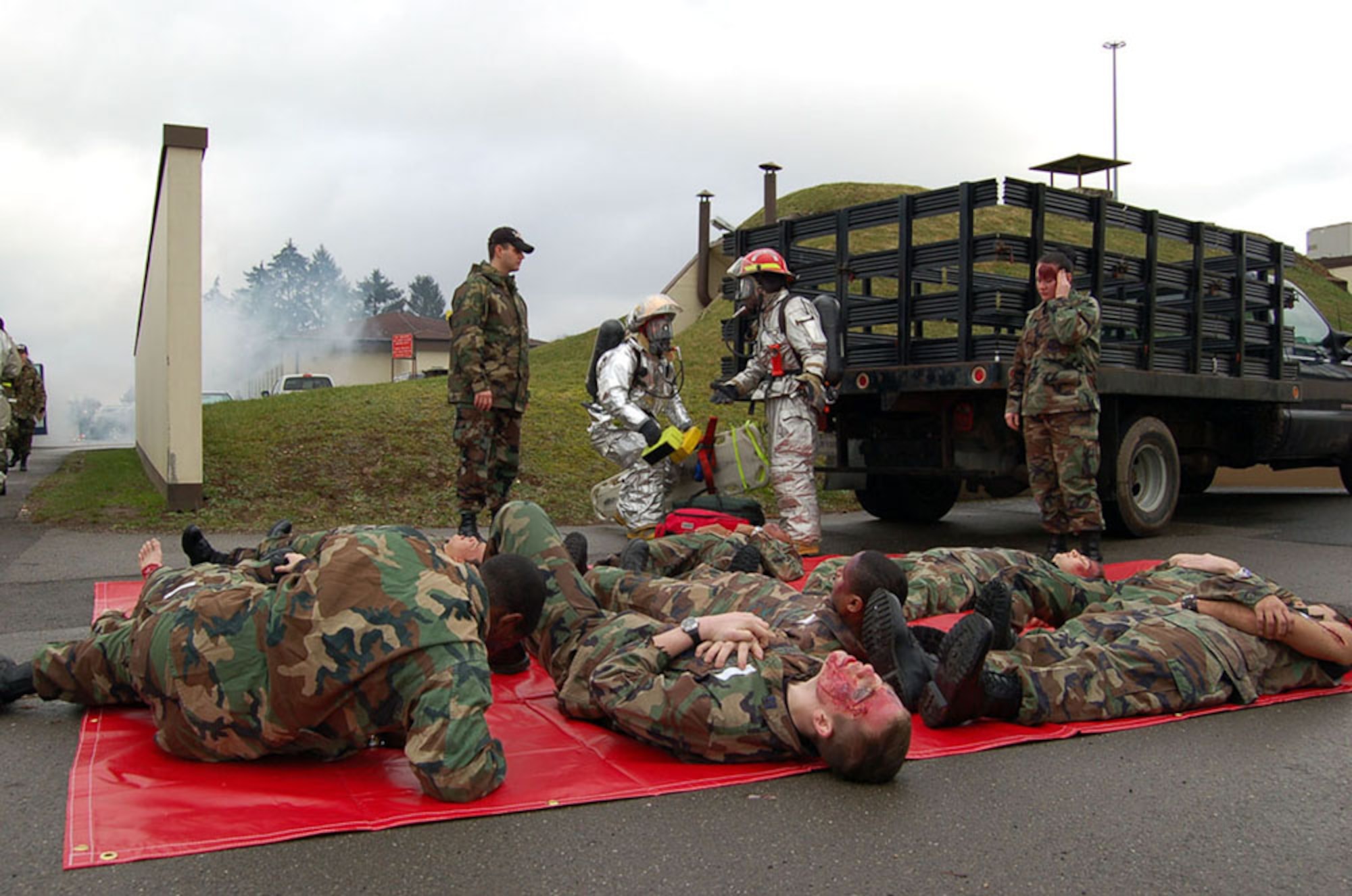 SPANGDAHLEM AIR BASE, GERMANY -- Volunteer “victims” take part in the wing’s Phase I mass casualty emergency management exercise Feb. 9. The exercise was designed to evaluate response elements and command and control procedures during a simulated bus and vehicle head-on collision. (US Air Force photo by Senior Airman Eydie Sakura)
