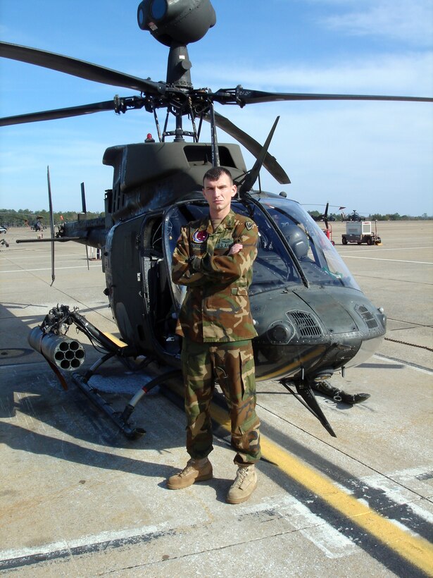 Army Warrant Officer 1 Derrick Rodriguez stands in front of his Kiowa Warrior following his graduation from the Army's Aviation School at Fort Rucker, Ala. America Supports You member Special Operations Warrior Foundation funded his attending college which led him to becoming an Army aviator. Courtesy photo
