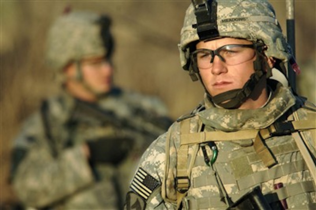 U.S. Army Pfc. Dustin Meadows leads a patrol formation to an extraction point after completion of a search for weapons caches near the Khark Water Treatment Facility in Taji, Iraq, on Feb. 13, 2007.  Meadows is assigned as a rifleman to Alpha Company, 2nd Battalion, 8th Cavalry Regiment.  