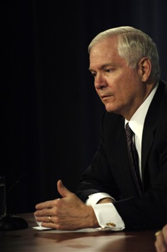 Secretary of Defense Robert Gates responds to a reporter's question during a media roundtable with Chairman of the Joint Chiefs of Staff Gen. Peter Pace, U.S. Marine Corps, in the Pentagon on Feb. 15, 2007.  