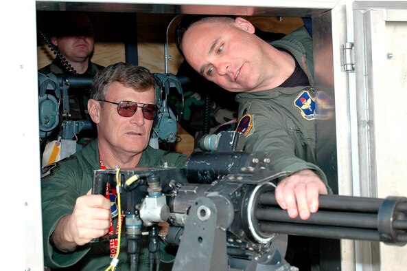 Lt. Col. Tom Marocchini, 58th Training Squadron commander, points out some of the features of the ?war wagon? mounted Gatling gun trainer to Maj. Gen. Irving Halter Jr., 19th Air Force commander. The ?war wagon? simulator for Gatling gun training gives students some gun practice time as part of the aerial gunner?s course. The general visited the wing Feb. 9. (U.S. Air Force photo by Staff Sgt. Markus Maier)