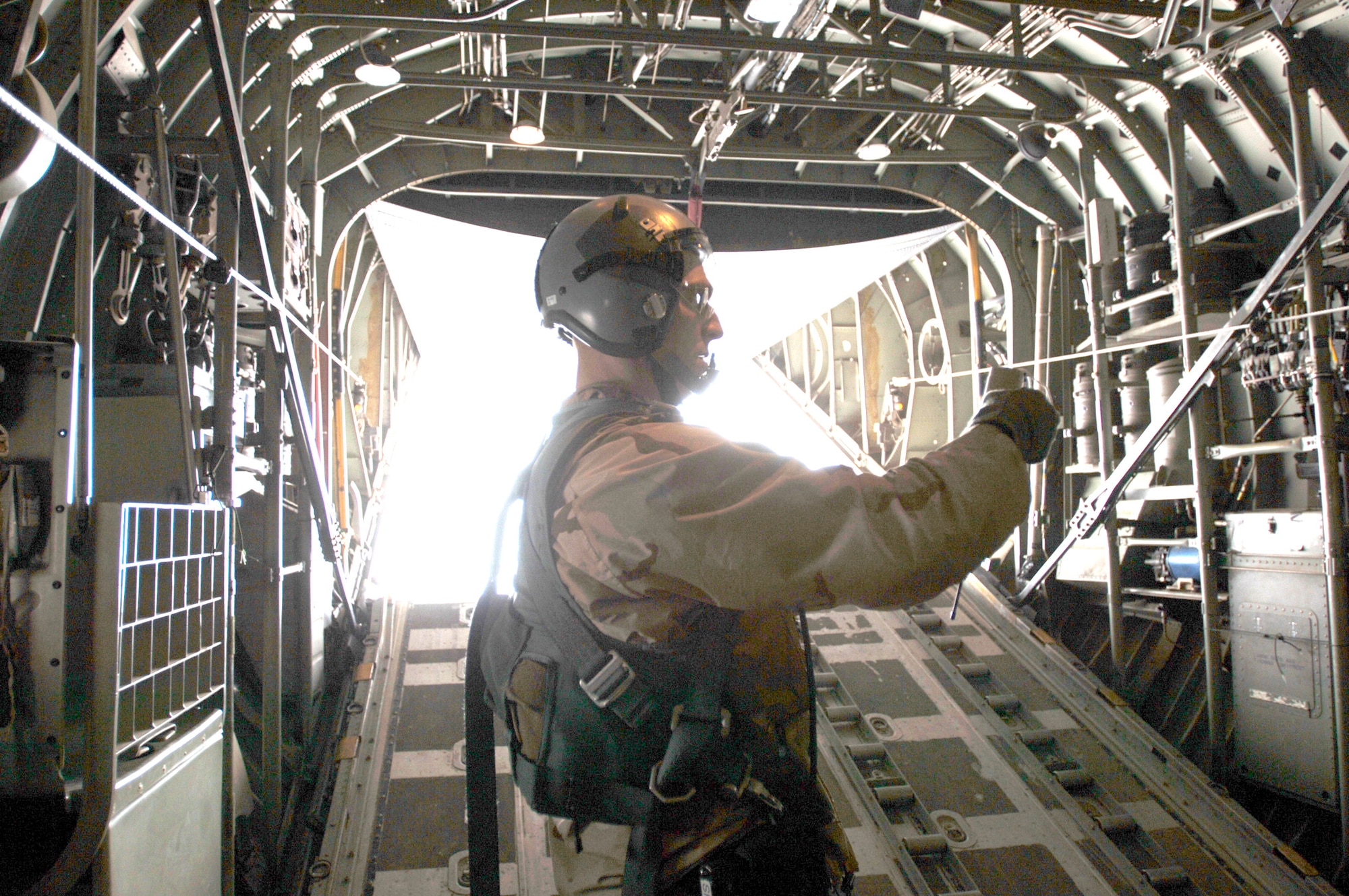 Staff Sgt. Dan Maslowski prepares to release a wind sonde sensor that provides weather analysis of drop zone winds just prior to the first employment of the Joint Precision Airdrop System in combination with the Improved Container Delivery System over Iraq Feb. 16. Pairing the JPADS mission planning software with the I-CDS bundles increases airdrop accuracy by 60 percent. Sergeant Maslowski is assigned to the 777th Expeditionary Logistics Readiness Squadron. (U.S. Air Force photo/Tech. Sgt. Cecilio M. Ricardo Jr.)