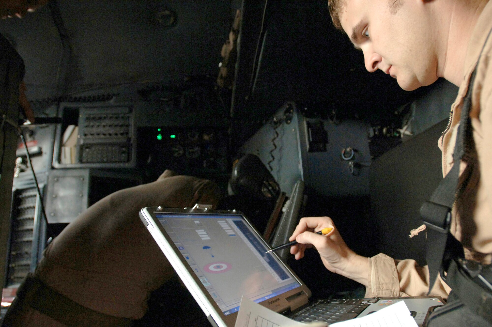 Capt. Kenny Bierman works with the Joint Precision Airdrop System mission planning software on a specialized laptop while onboard a C-130 Hercules Feb. 16 over Iraq, as he prepares for the first employment of JPADS with the Improved Container Delivery System in support of Operation Iraqi Freedom. Captain Bierman is assigned to the 777th Expeditionary Airlift Squadron. (U.S. Air Force photo/Tech. Sgt. Cecilio M. Ricardo Jr.) 