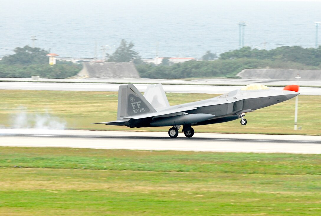 An F-22 Raptor lands at Kadena Air Base, Japan, Feb. 18, marking the aircraft's first overseas deployment. The jet is one of 12 along with more than 250 Airmen deployed from Langley Air Force Base, Va., to Kadena as part of an air expeditionary force rotation. (U.S. Air Force photo/Airman 1st Class Kelly Timney)