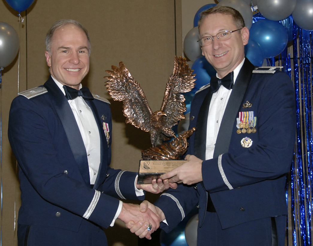 Airman 1st Class Steven Hadley of the 366th Training Squadron is the 2006 Junior Honor Guardsman of the Year for the 82nd Training Wing. Airman Hadley served at 145 honor guard details in 2006, equating to 4,900 man hours. Accepting the award on behalf of Airman Hadley was 366th TRS Commander Lt. Col. David Caffee. Brig. Gen. Richard Devereaux, 82nd TRW commander, presented the award Feb. 16 at the wing's annual awards banquet. (U.S. Air Force photo/Sandy Wassenmiller)